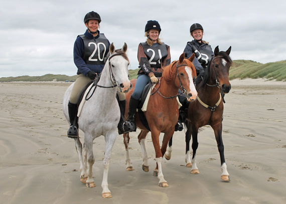Aurora Raffeah with Janina, Aurora Reniah with Robin, and Mystique with Kimberley on Oreti Beach during the latest Mt Linton Endurance Ride.